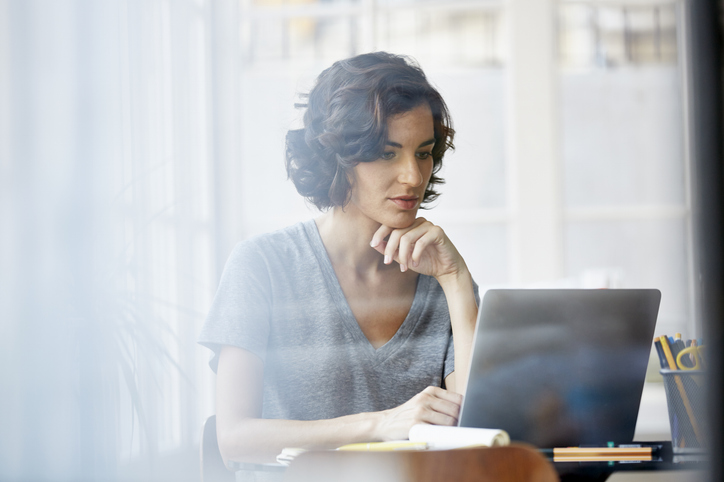 businesswoman-using-laptop-in-office