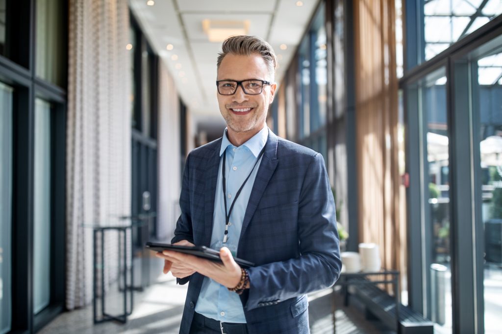 entrepreneur-standing-in-hotel-corridor